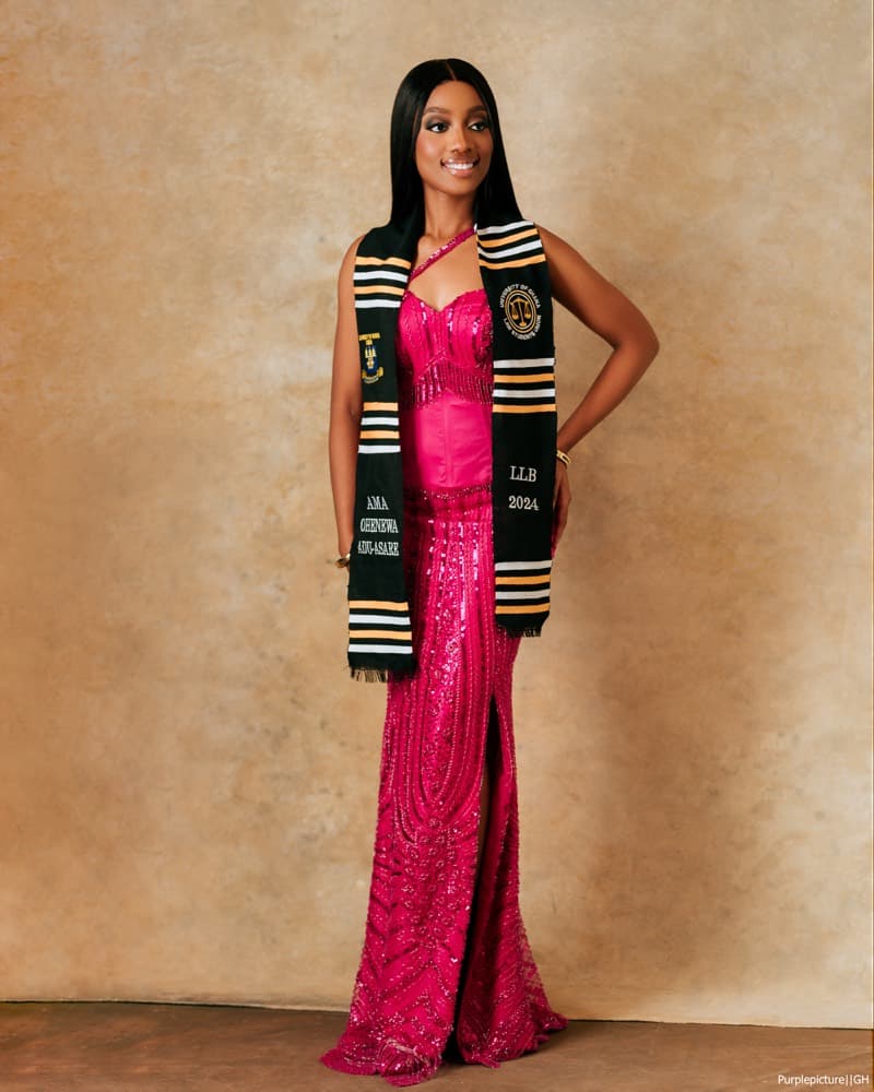 Graduate in a pink gown and university stole